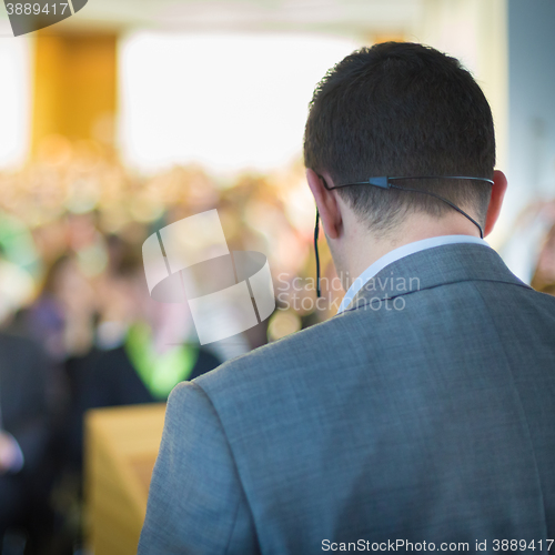 Image of Speaker at Business Conference and Presentation.