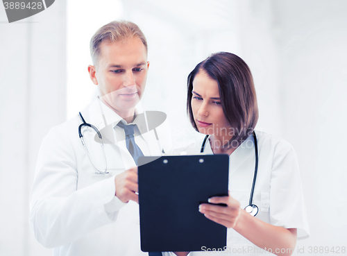 Image of two doctors writing prescription