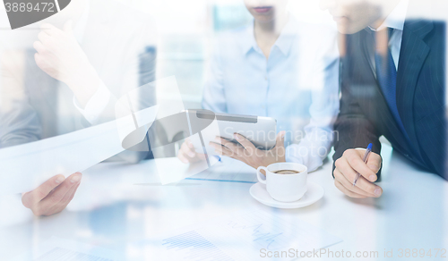 Image of business team with graph, tablet pc and coffee