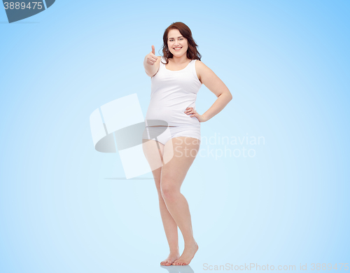 Image of plus size woman in underwear showing thumbs up