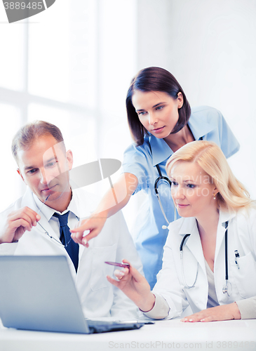Image of doctors looking at laptop on meeting