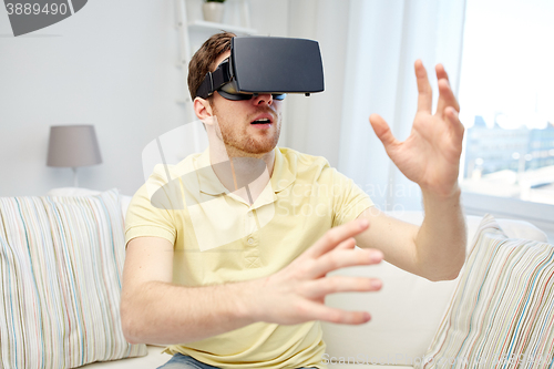 Image of young man in virtual reality headset or 3d glasses