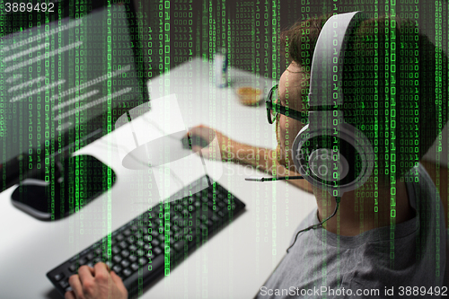 Image of close up of man playing computer video game