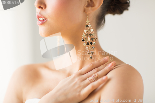 Image of close up of beautiful woman with earrings