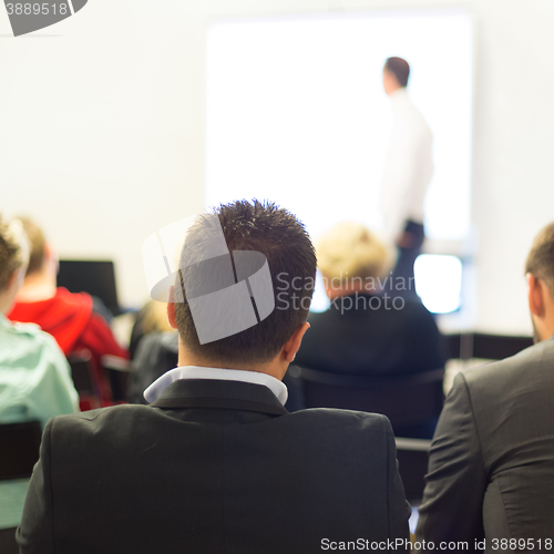 Image of Speaker at Business convention and Presentation.