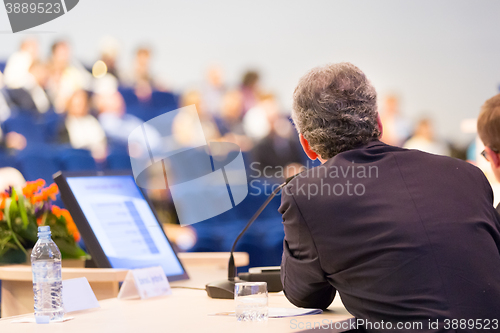 Image of Speaker at Business Conference and Presentation.