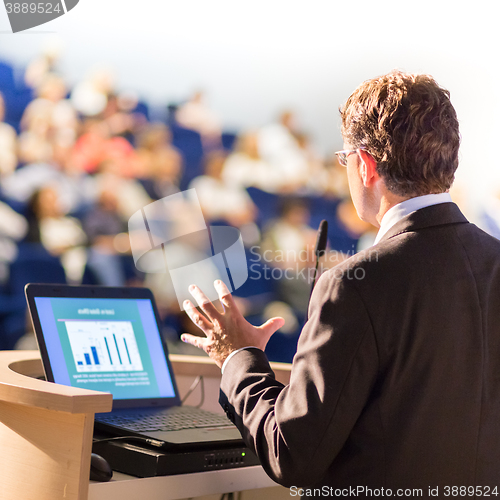 Image of Speaker at Business Conference and Presentation.