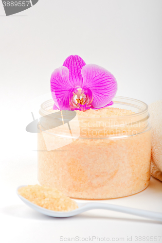 Image of Salt, spoon, towel and orchid