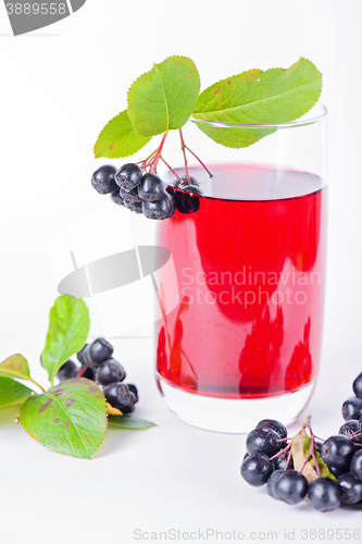 Image of Glass of aronia juice with berries