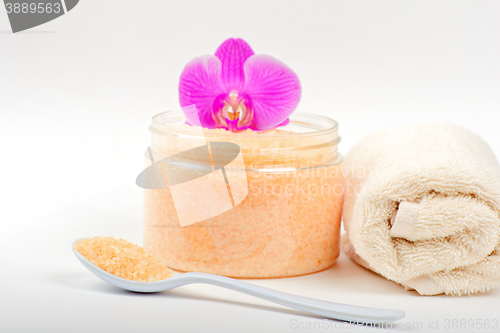 Image of Salt, spoon, towel and orchid