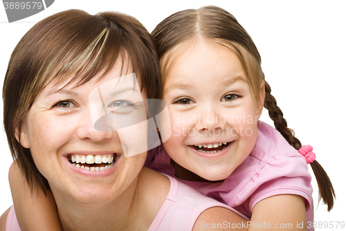 Image of Portrait of a happy mother with her daughter