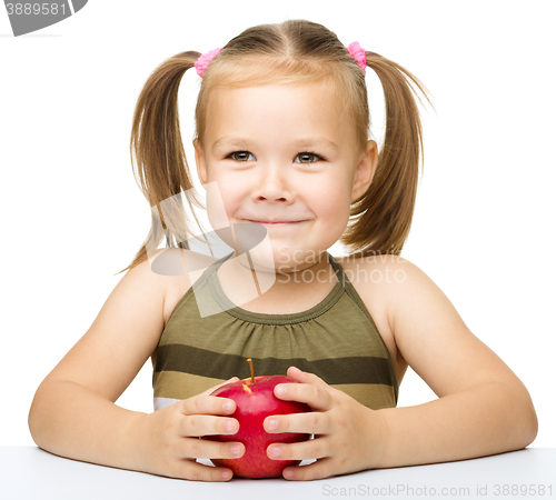 Image of Little girl with red apple