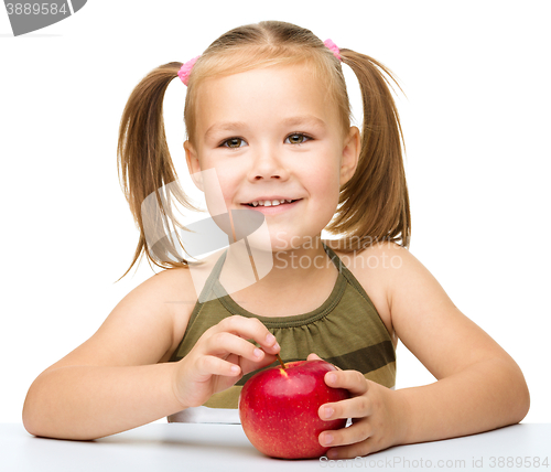 Image of Little girl with red apple