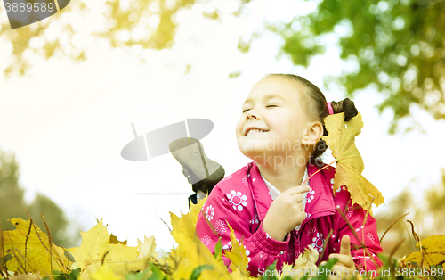 Image of Portrait of a little girl in autumn park