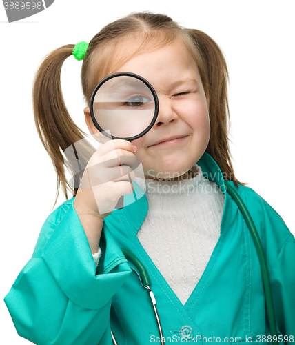 Image of Cute little girl is playing doctor