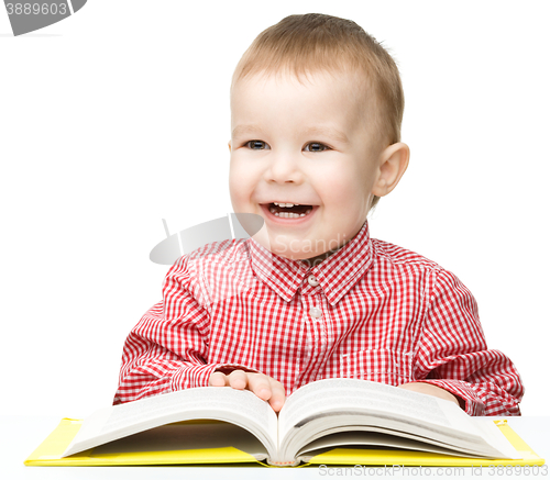 Image of Little child play with book