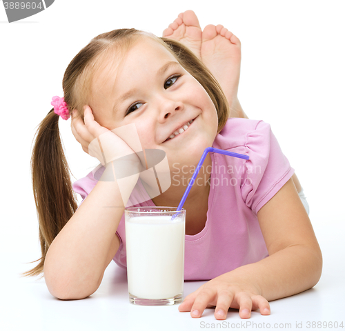 Image of Cute little girl with a glass of milk
