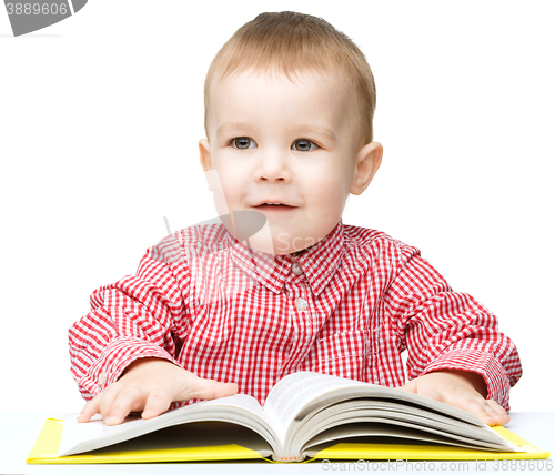 Image of Little child play with book