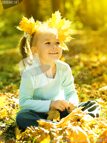 Image of Portrait of a little girl in autumn park