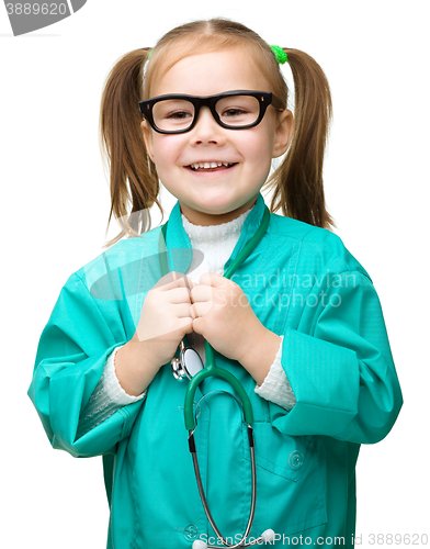 Image of Cute little girl is playing doctor