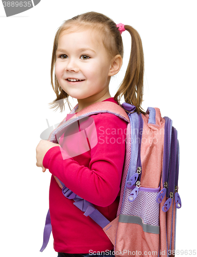 Image of Portrait of a cute little schoolgirl with backpack