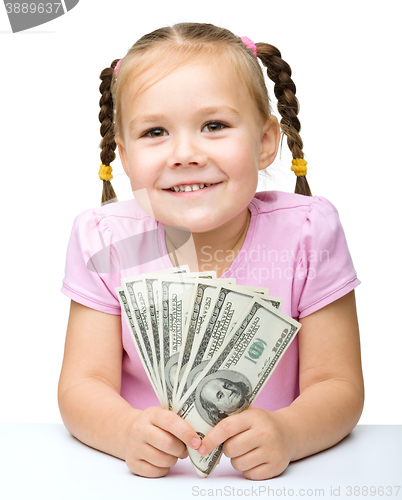 Image of Little girl with dollars