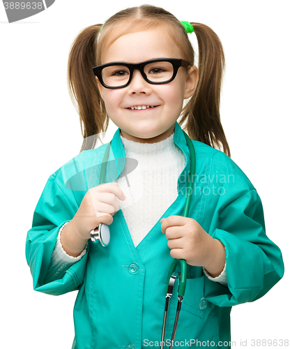 Image of Cute little girl is playing doctor