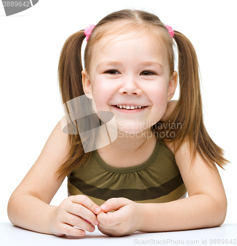 Image of Little girl with red apple