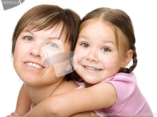 Image of Portrait of a happy mother with her daughter