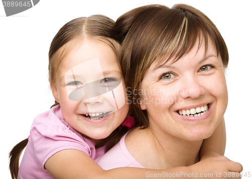 Image of Portrait of a happy mother with her daughter