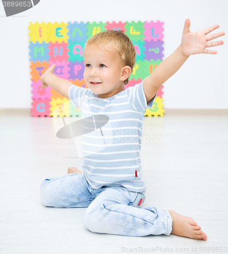 Image of Children are sitting on floor