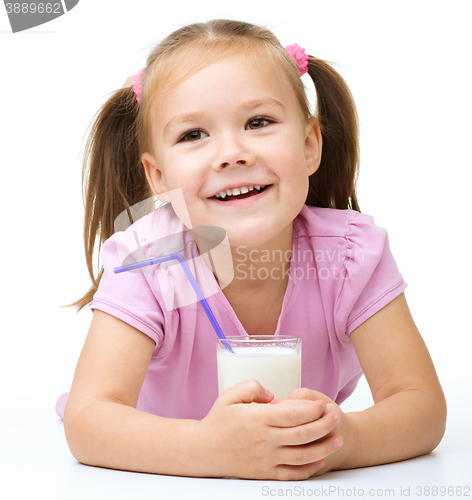 Image of Cute little girl with a glass of milk