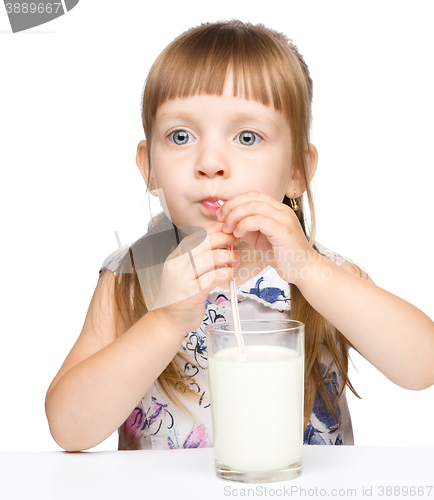 Image of Cute little boy with a glass of milk