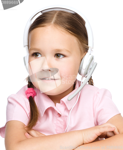 Image of Young girl is working as an operator at helpline