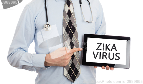 Image of Doctor holding tablet - Zika virus