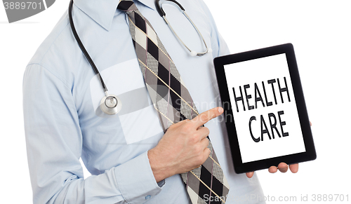 Image of Doctor holding tablet - Healthcare