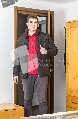 Image of Tourist Entering in the Hostel Room