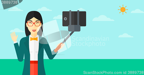Image of Woman making selfie.