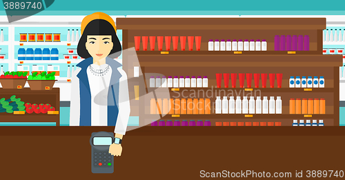 Image of Woman paying with smart watch.