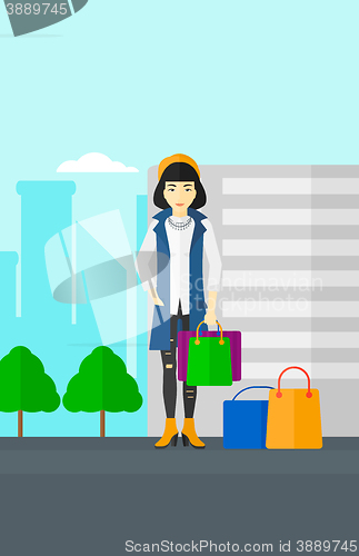 Image of Buyer with shopping bags.