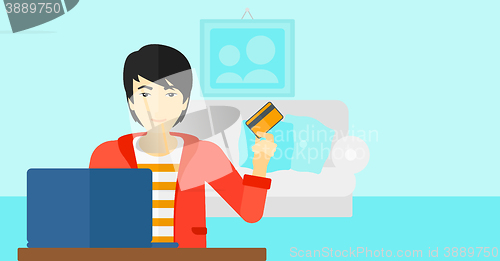 Image of Man making purchases online.