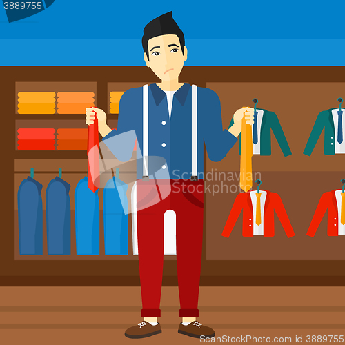 Image of Customer choosing neckties.