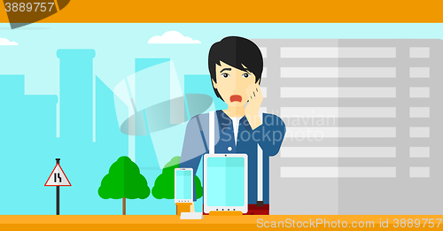 Image of Man looking at shop window.