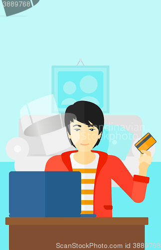 Image of Man making purchases online.