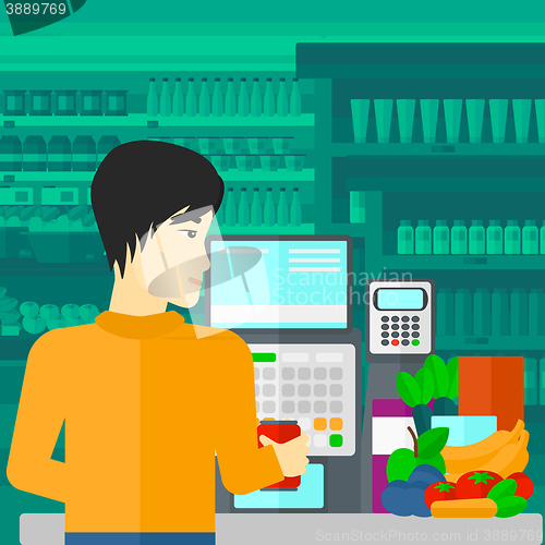 Image of Cashier at supermarket checkout.