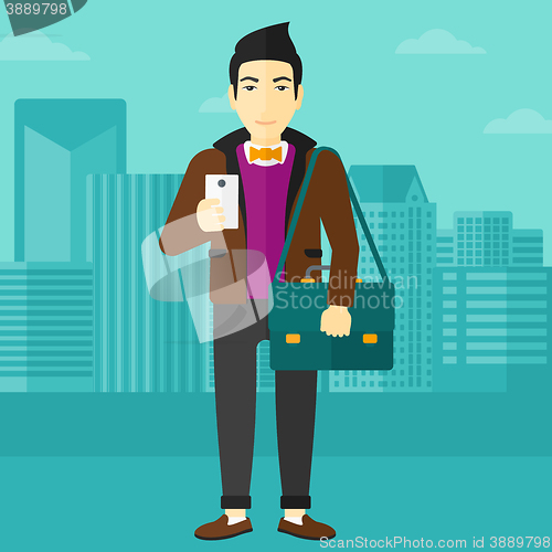 Image of Man using smartphone.