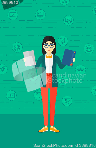 Image of Woman choosing between book and tablet computer.