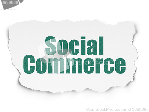 Image of Advertising concept: Social Commerce on Torn Paper background