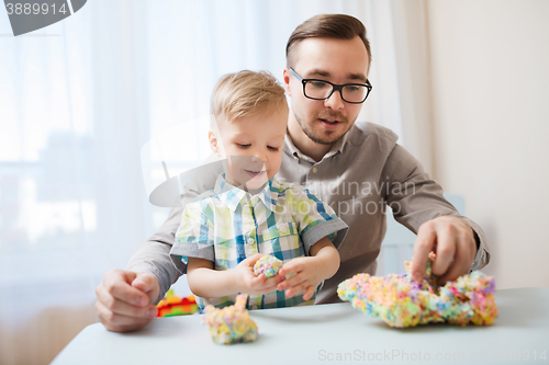 Image of father and son playing with ball clay at home