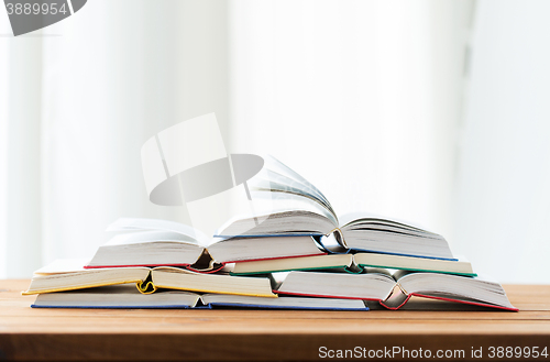 Image of close up of books on wooden table